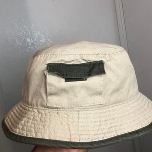 Tan and green bucket hat with a pocket